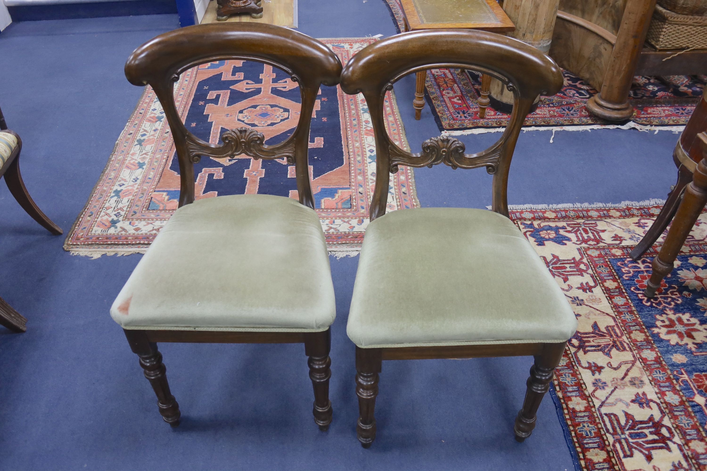 A set of six Victorian style mahogany balloon back dining chairs together with a Victorian dining chair (7)